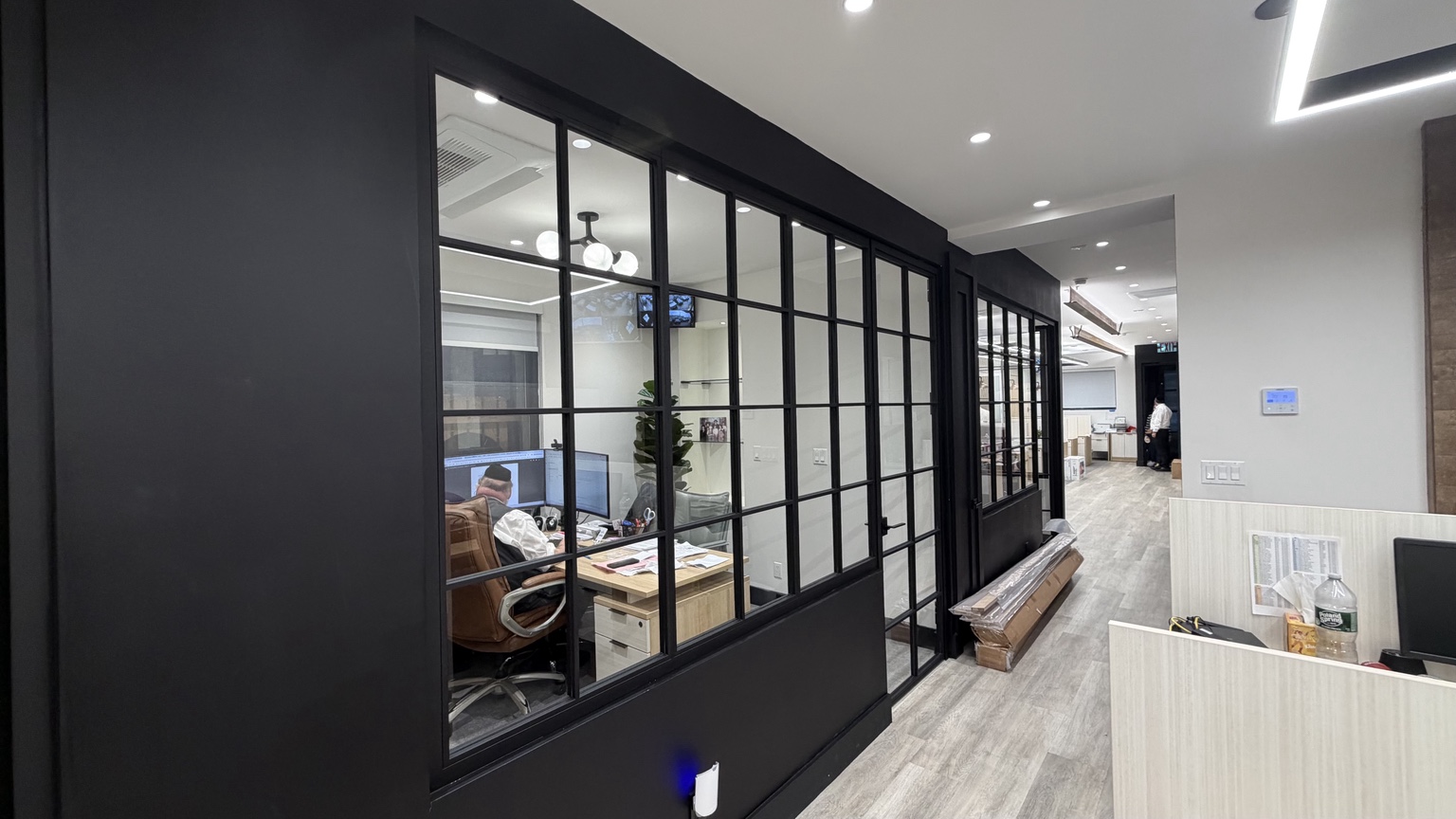 Custom black framed glass office wall